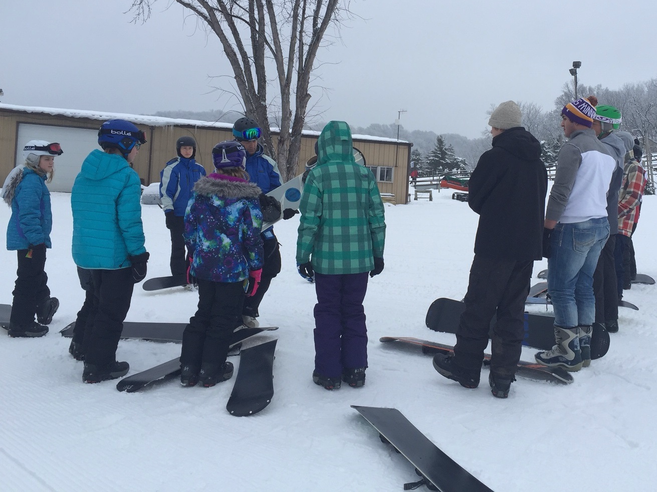 Ski instructor talking to students